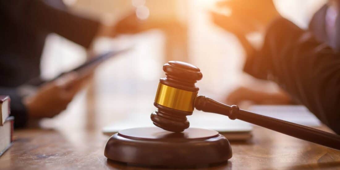 Lawyers settling an auto accident lawsuit.
