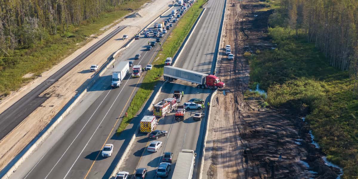 Truck accident case scene showing damaged commercial vehicle with legal liability and causes analysis